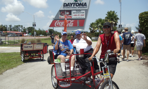 Redi Pedi pedicab drivers offers rides at the Coke Zero 400 in Florida.